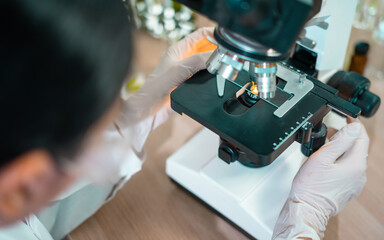 Female scientist researcher conducting an experiment in a labora
