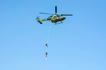 Para commando Slithering and Rappelling from helicopter. Air force demonstrate their capability in front of public