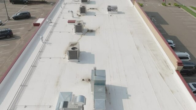 HVAC condenser units at the rooftop of building, aerial 