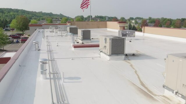 HVAC condenser units at the rooftop of building, aerial closeup