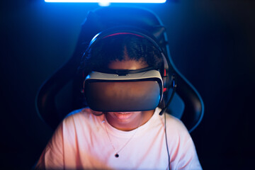 Teen playing in video game club in VR headset