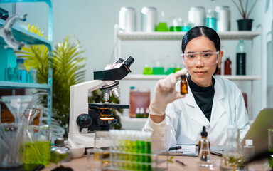 Fototapeta premium Scientist female researching with plant biotechnology concept with in laboratory. 