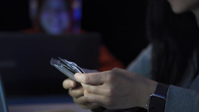 Profitable hacker counting money.