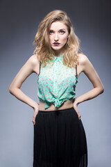 Hair Ideas. Portrait of Nice Winsome Blond Caucasian Girl With Flyaways Hair. Isolated Over Gray Background.