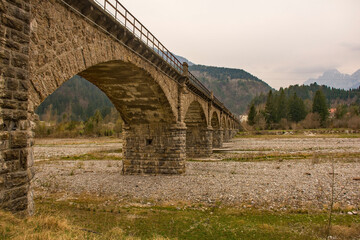 A stone bridge passing over the Torrente Degano river just north of Ovaro village in Carnia, Udine Province, Friuli-Venezia Giulia, north east Italy
