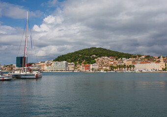 The waterfront of the historic coastal city of Split in Dalmatia, Croatia. Marjan Hill is centre...