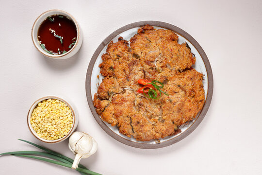 Nokdujeon or Nokdu Bindaetteok is a Savory Korean Pancake Made With Ground Mung Beans.