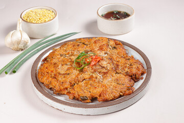 Nokdujeon or Nokdu Bindaetteok is a Savory Korean Pancake Made With Ground Mung Beans.