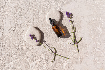 Glass bottle of Lavender essential oil with fresh lavender flowers , aromatherapy spa massage concept. Lavendula oleum