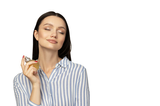 PNG,attractive girl in a shirt with perfume in her hand, isolated on white background