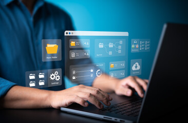 Businessman using laptop computer to manage file document on company server. Cloud backup online...