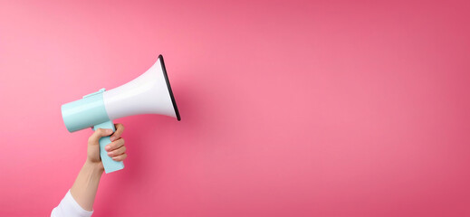 Megaphone in woman hand on a pink background. Copy space. Place for text. Generative AI