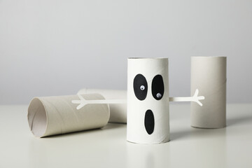 Paper ghost and sleeve on white background