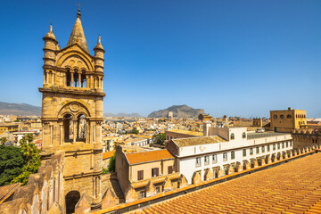 Fototapeta na wymiar Palermo Cathedral, view of tower with cityscape from roof of cathedral, a major landmark and tourist attraction in capital of Sicily, Italy, Europe.