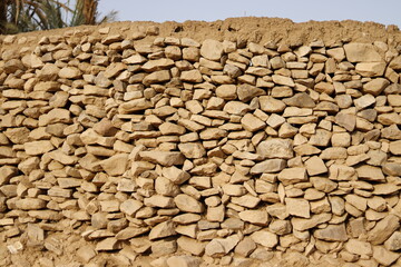 Ancient wall made of stones of different shapes Rural northern Sudan