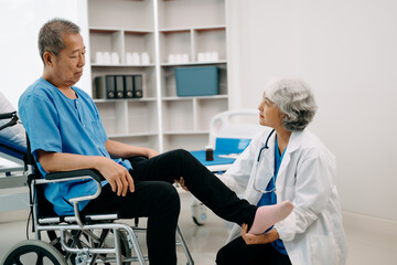 Asian physiotherapist helping elderly man patient stretching arm during exercise correct with dumbbell in hand during training hand in bed in clinic