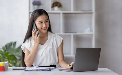 Portrait smile beautiful business asian designer woman working office desk calling and thinking about business. Small business employee freelance online sme marketing e-commerce telemarketing concept