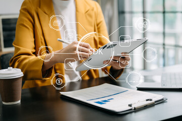 SDK  Software development kit programming language technology concept, Person typing laptop computer and tablet with SDK icon on virtual screen. in office.