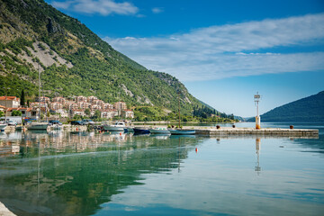 Fototapeta na wymiar Beautiful view from the embankment of a small town Risan in Bay of Kotor on a sunny day