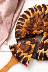 Plum pie on the table. Top view.