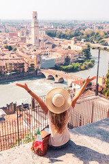 Young female traveler enjoying Verona city pamoramic view- Travel, tour tourism,vacation in Italy