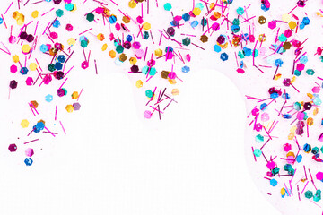 Colorful glitter sparkle confetti background liquid drops of paint color flow down on white canvas....