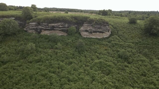 4k Aerial footage of Bridstones sandstone rock formations in Dalby Forest, North Yorkshire