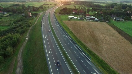 Aerial of Cars on Countryside Highway Road at Sunset