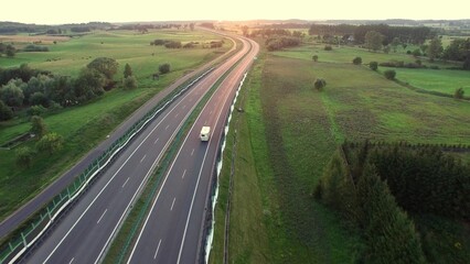 Aerial of Cars on Countryside Highway Road at Sunset