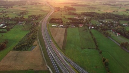 Aerial of Cars on Countryside Highway Road at Sunset