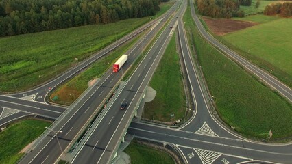 Aerial of Cars and Trucks On Highway Crossroads at Sunset