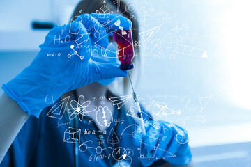 science, research and chemistry concept - young scientist in safety glasses with test tube and virtual projection of chemical formula.