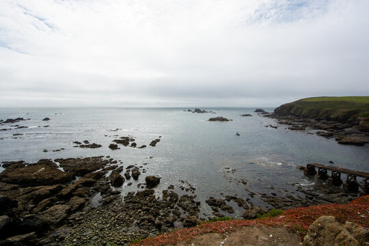 Lizard, Cornwall, UK - August, 2023: View of Lizard Point in Cornwall - the most southern point of England's mainland. Copy space in sky.