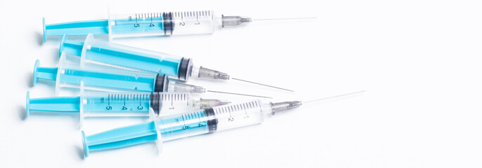 Disposable plastic syringe prepared for injection and vaccination in the hospital. The concept of...
