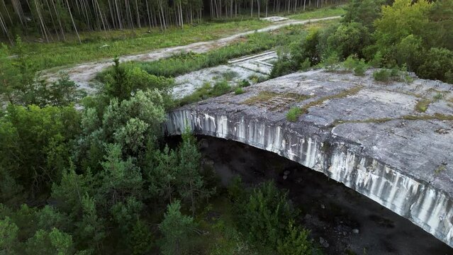 Upwards and backwards directed drone flight in front of lost place bunker Weingut 1