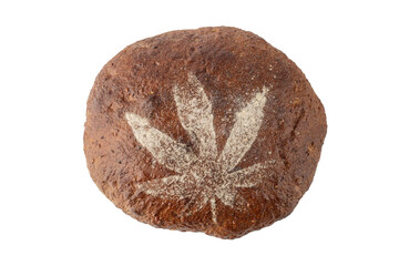 Fresh baked loaf of spelt bread with crushed hemp seeds is decorated with cannabis leaf made of...