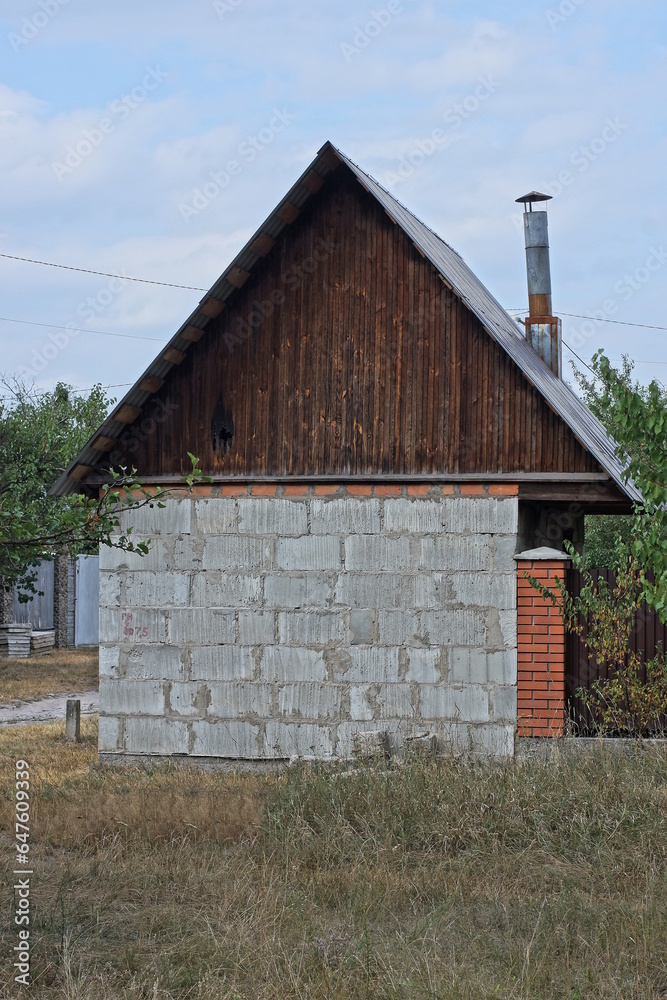 Canvas Prints one white gray brick rustic barn with brown wooden loft outside