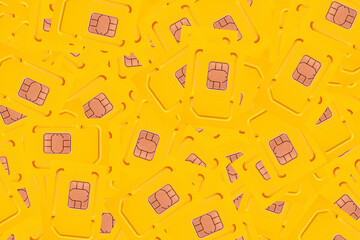 a bunch of yellow SIM cards for phones close-up top view - 647610374