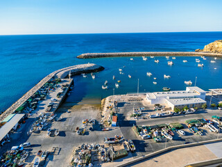 Aerial view landscape, view of port in Portugal Albufeira, fishing boats, waterfront marina.