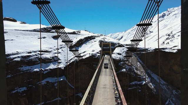 drone fly above Asia's highest Chicham Bridge in spiti himachal pradesh India with Himalayan mountains landscape covered in snow 