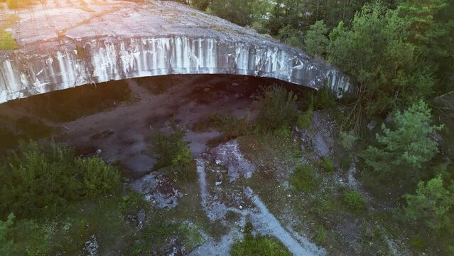 Drone rising in front of lost place bunker Weingut 1 during sunset