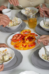 Family having lunch in kitchen at the table. Concept