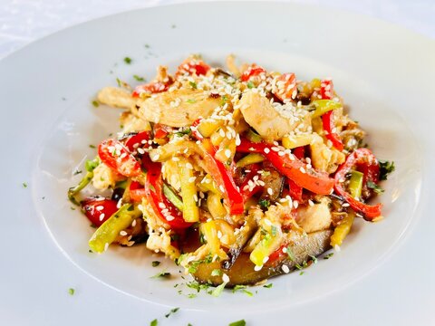 Close-up Of A Bowl Of Asian Stir Fried Chicken With Vegetables