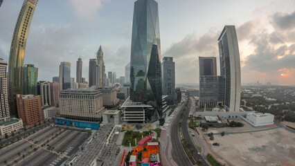 Panorama of Dubai International Financial district aerial night to day timelapse. View of business office towers.