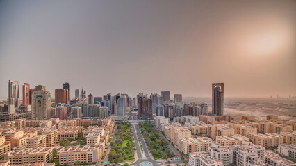 Sunrise over skyscrapers in Barsha Heights district and low rise buildings in Greens district...