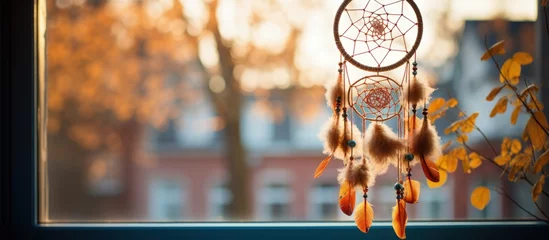 Foto auf Acrylglas Stockholm A Stockholm home displays a dream catcher in the window