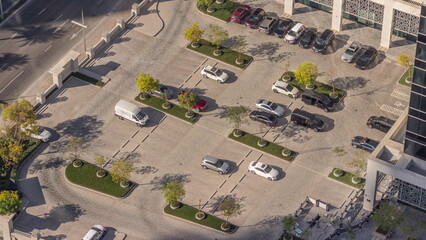 Car parking lot viewed from above all day timelapse, Aerial view. © HyperlapsePro
