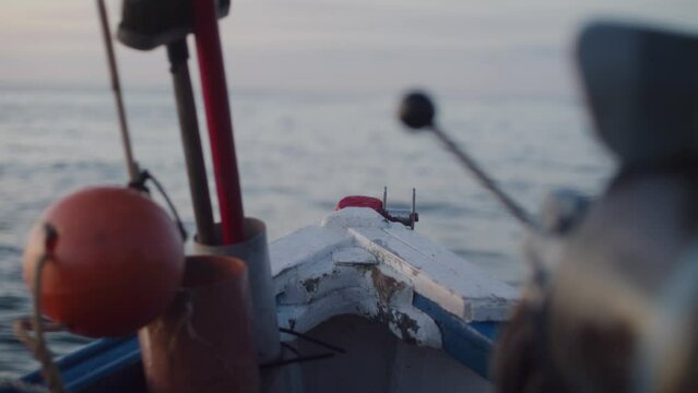 Shot of fishing boat out at sea with equipment and buoys