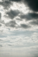 Sky background with light and dark clouds