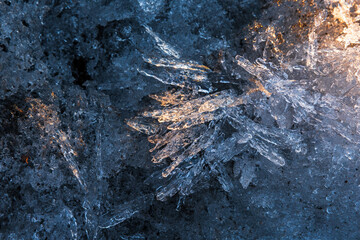 Ice crystals surface in a sunlight, macro photo